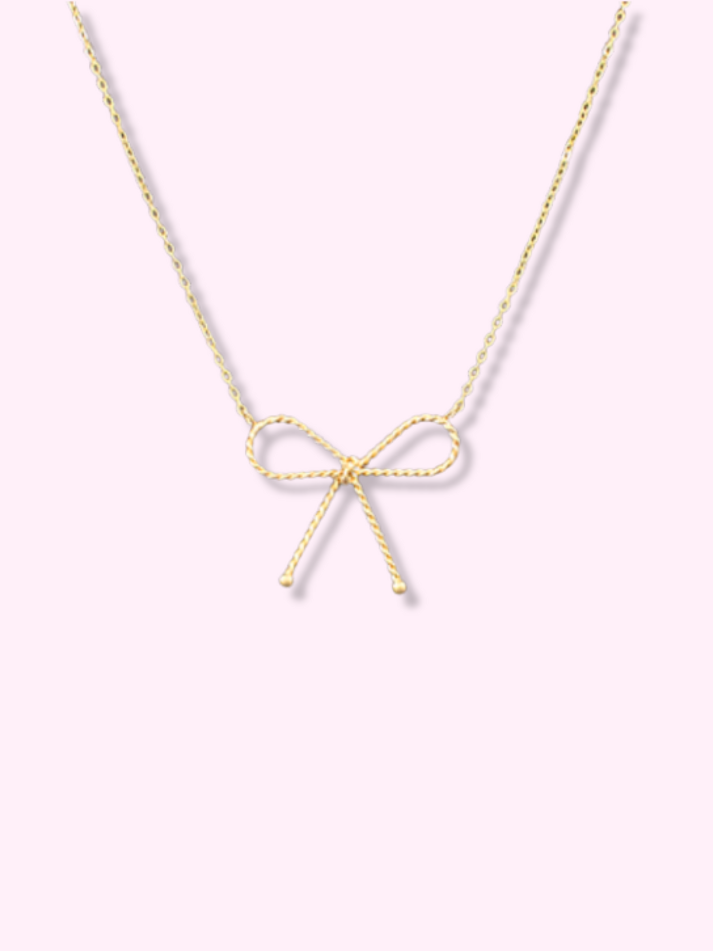 Gold bow necklace with twisted rope design from Sassy Shortcake