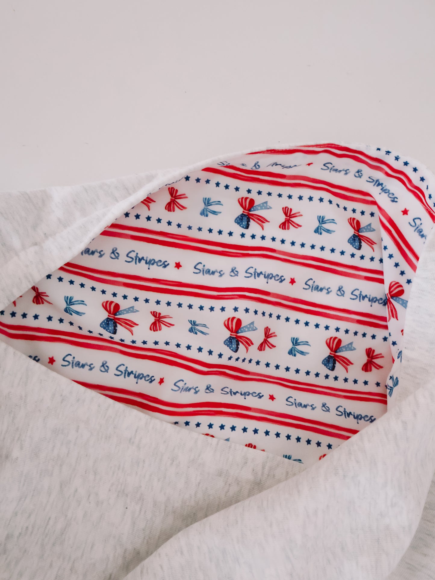 Close-up of inner hood lining on patriotic grey hoodie.