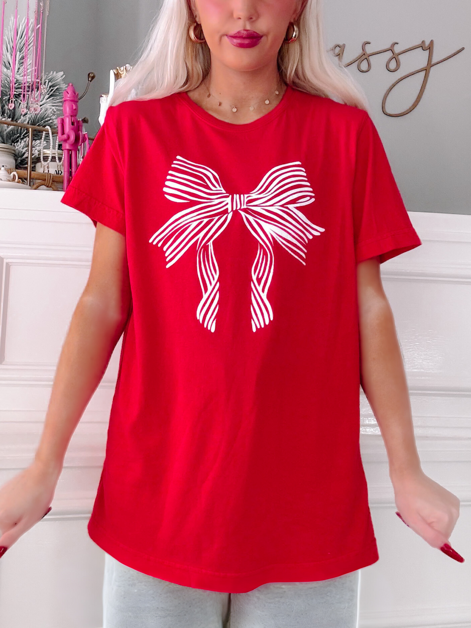 Red Lexi Bow Tee featuring a white striped bow graphic.