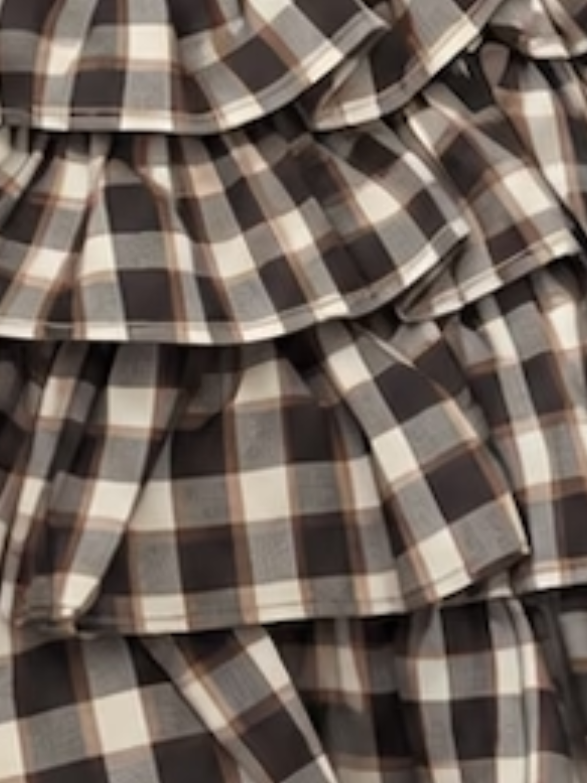 up close pic of the Crimson Charm Plaid Ruffle Skirt Brown