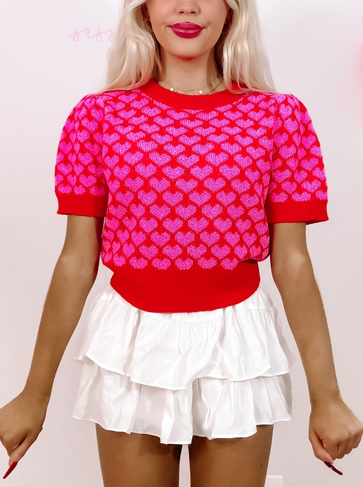 Red heart-print cropped sweater; Valentine's Day top.