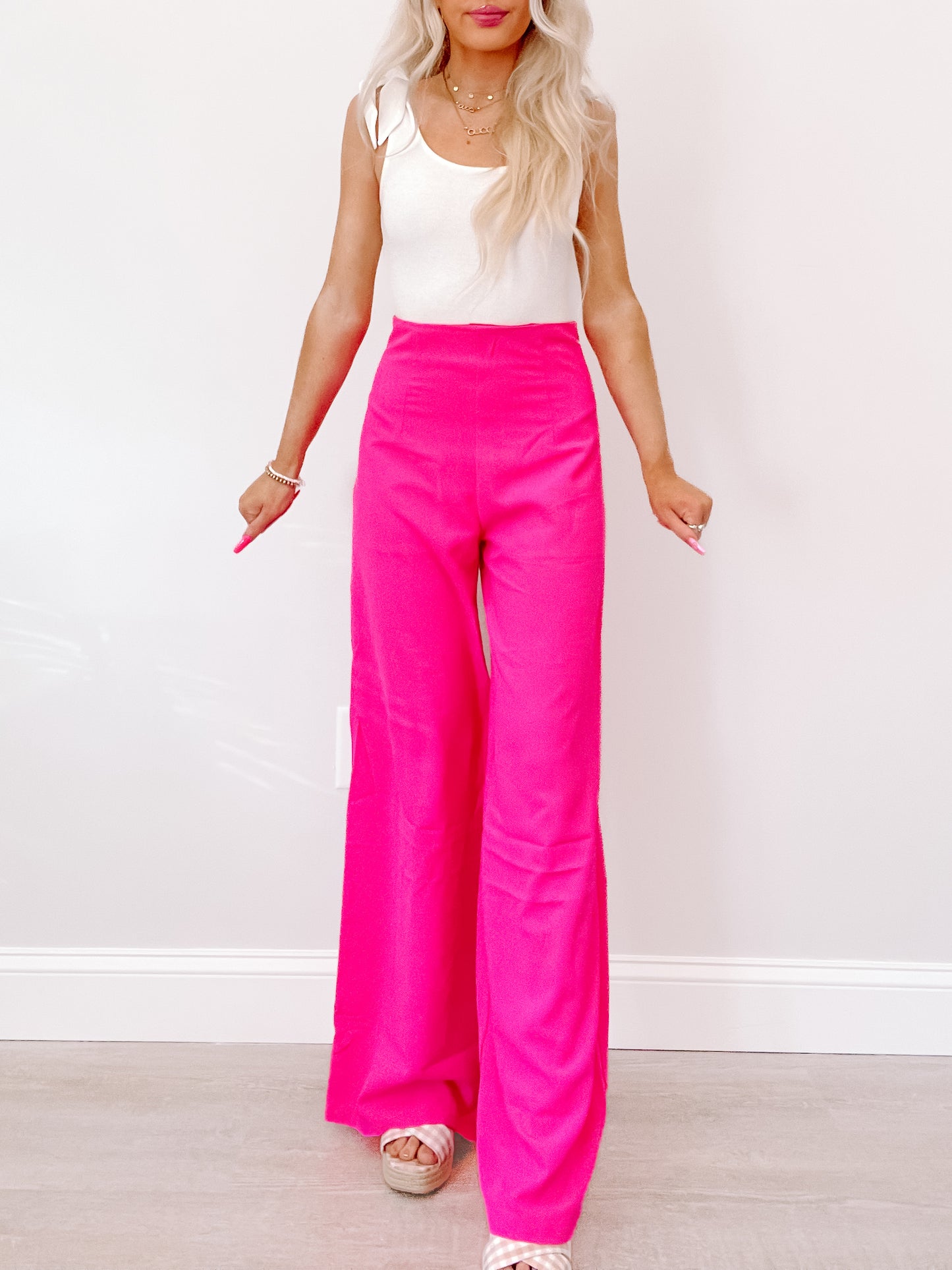Paradise Pink Wide-Leg Pants: Vibrant hot pink, high-waisted, flattering fit.