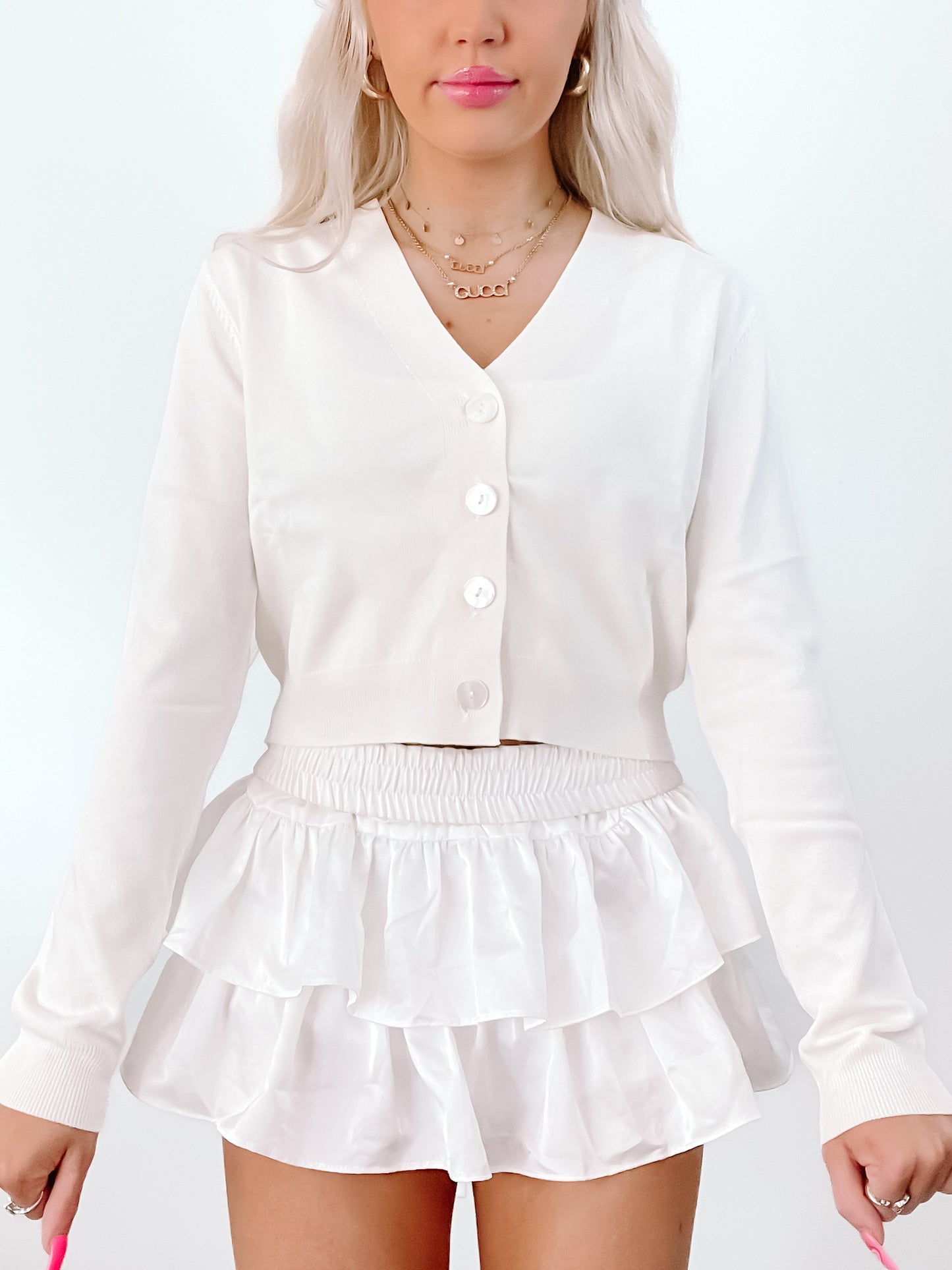 Ivory Spencer Cardigan: Cropped, button-front knit cardigan in white.
