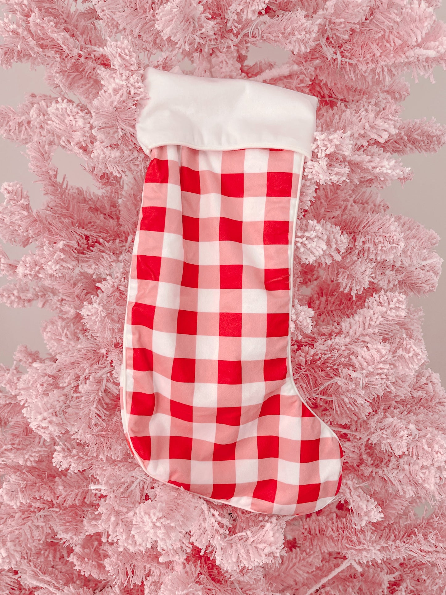 Red and pink gingham Christmas stocking with white cuff