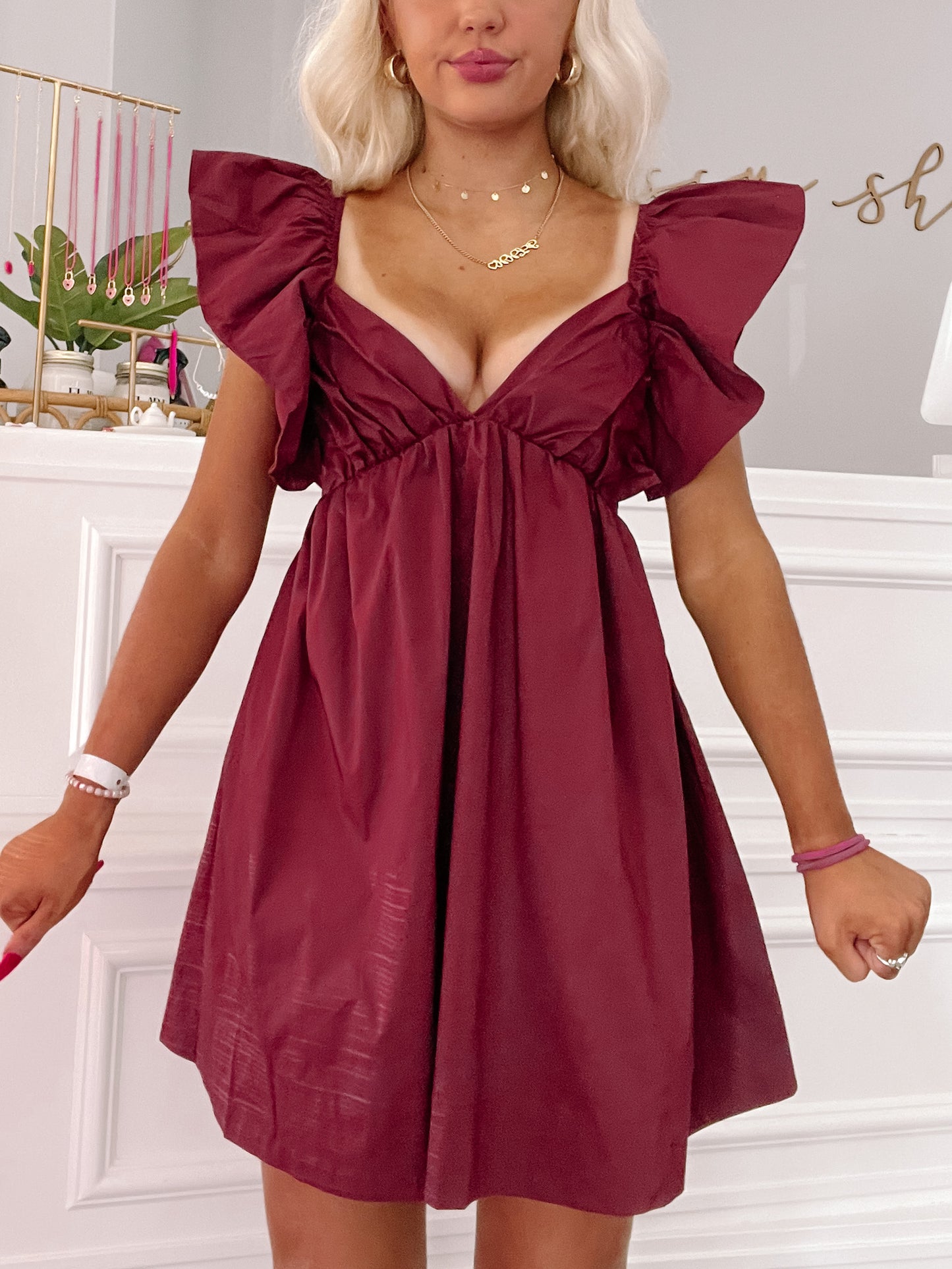 Garnet Cabo Cutie Dress: Burgundy mini dress with ruffle sleeves.