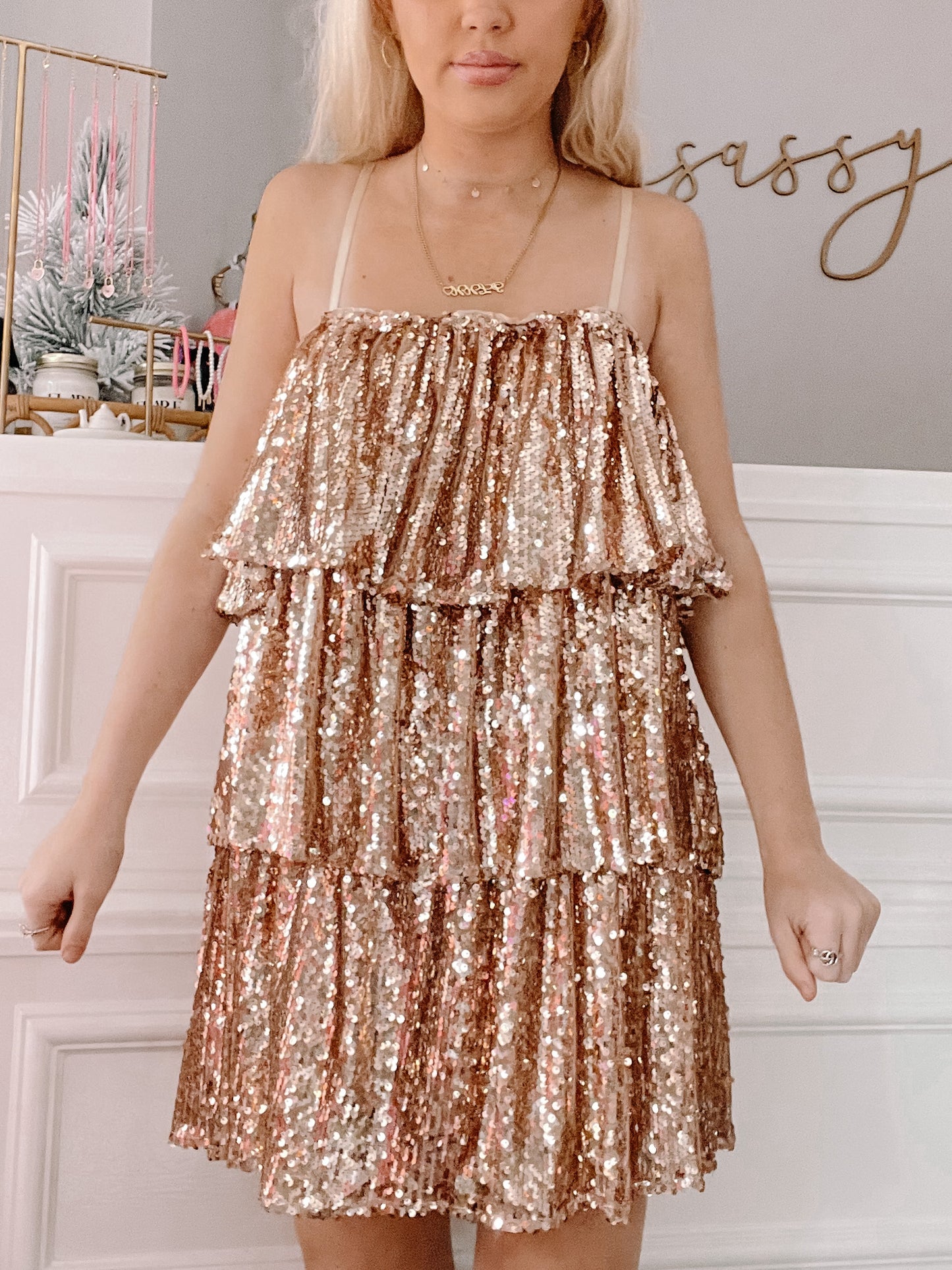 Rose gold tiered sequined mini dress, perfect for parties.