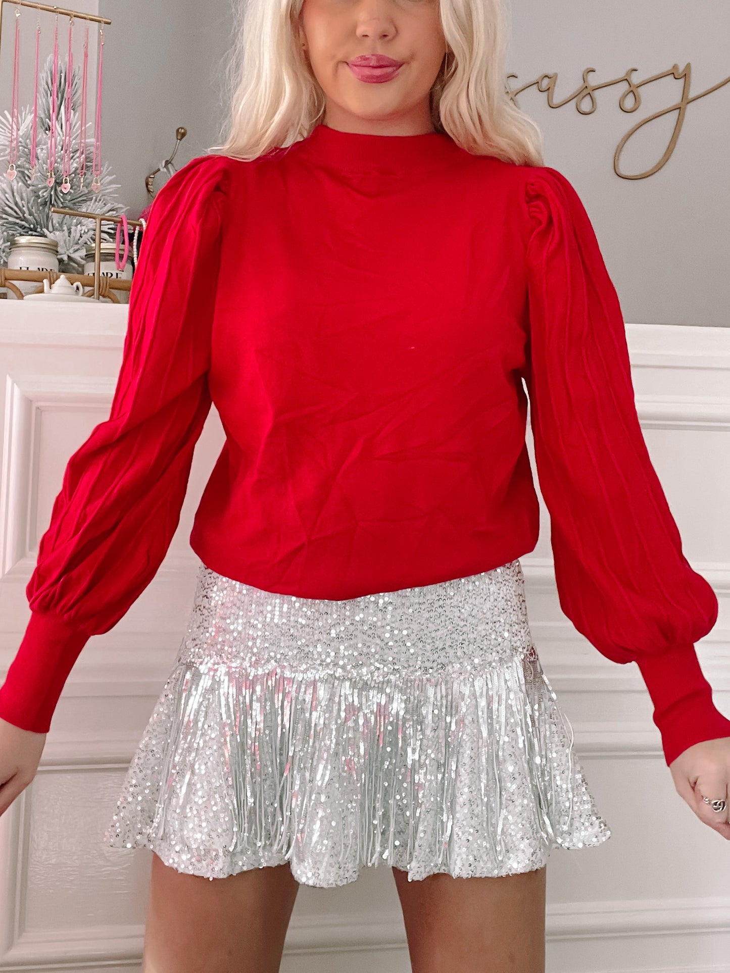 Red Marnie sweater with puff sleeves.