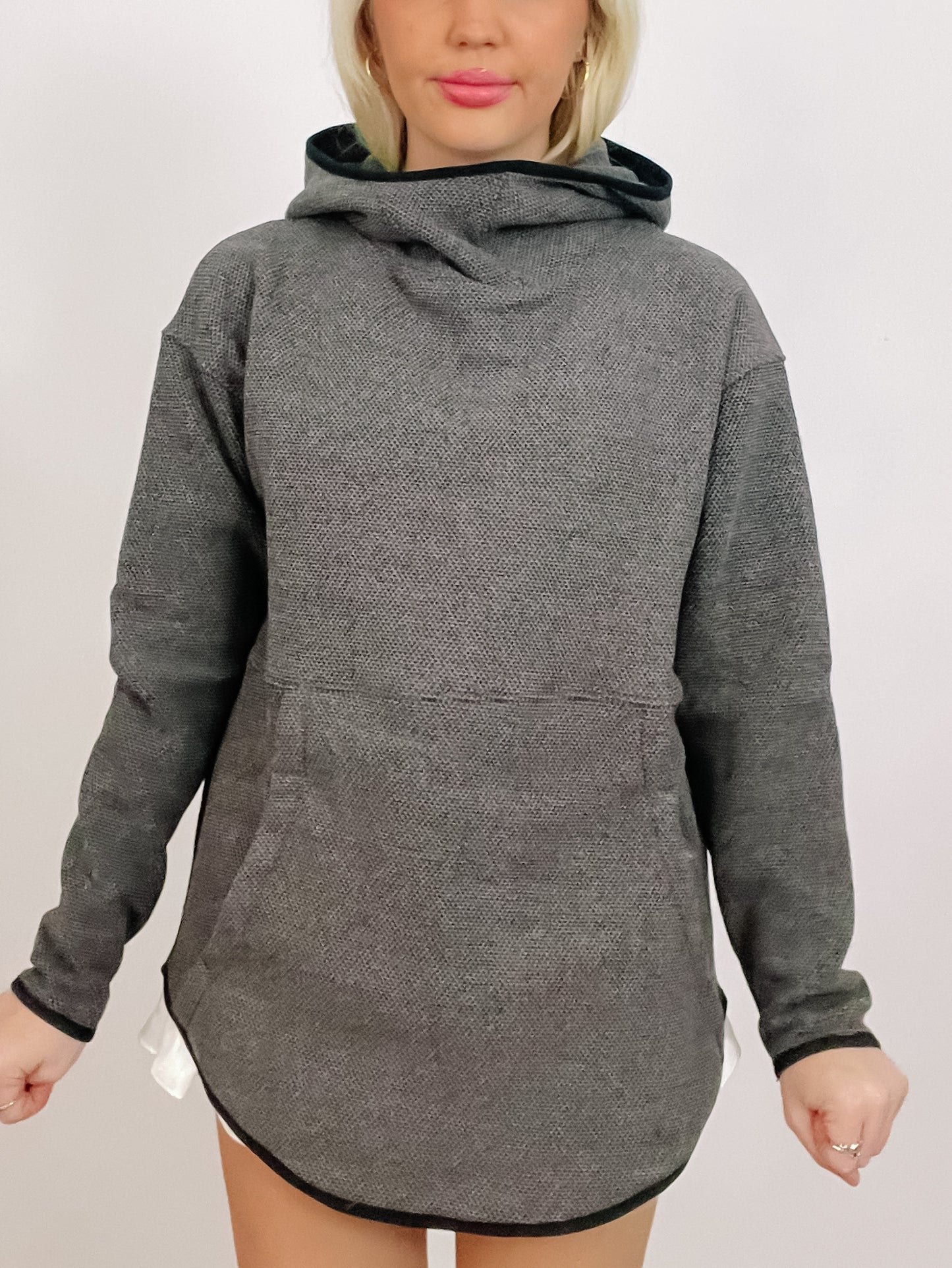 Gray textured long-sleeve hoodie with kangaroo pocket and curved hem.