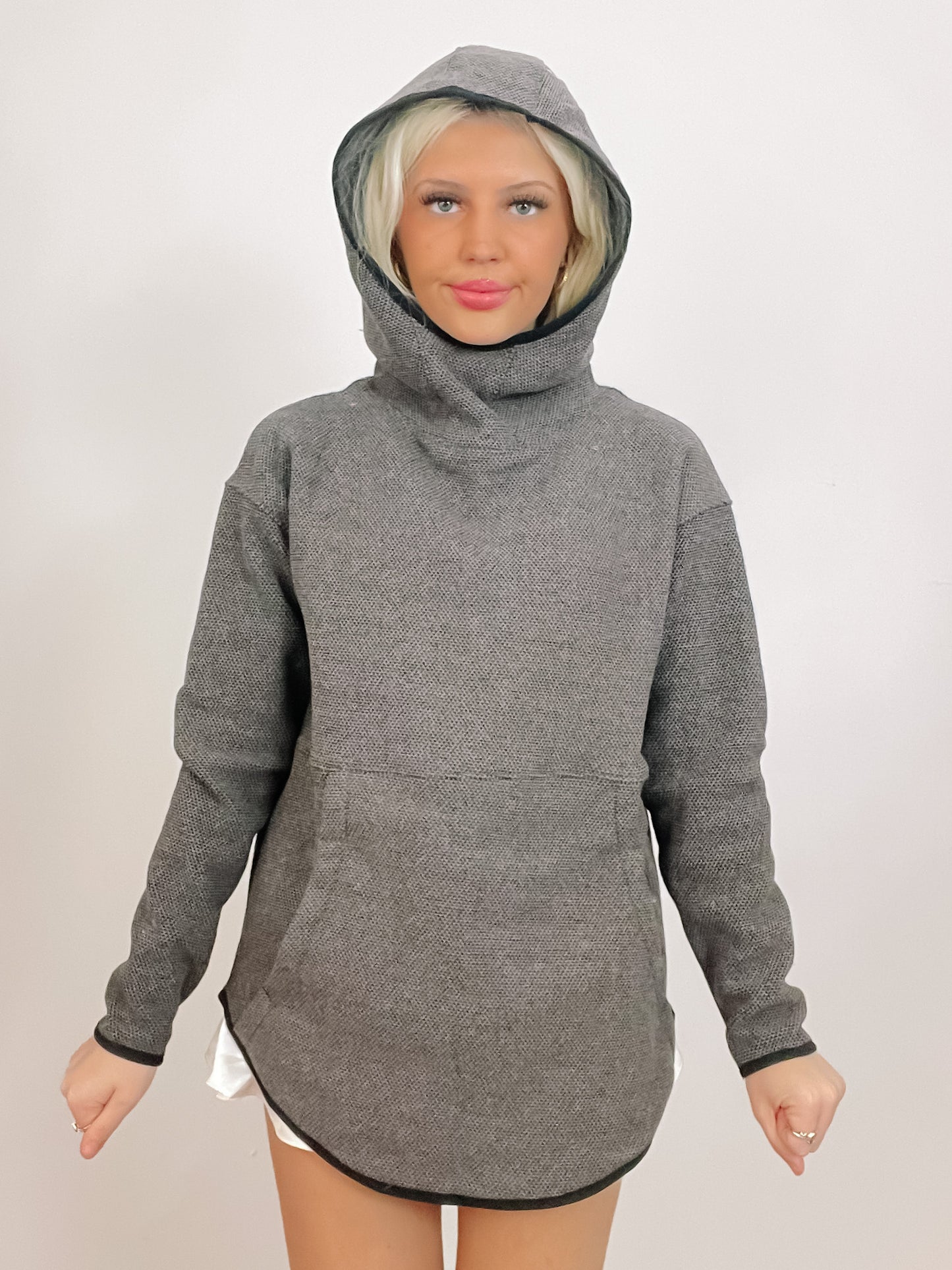 Charcoal gray hooded sweatshirt with curved hem, modeled against a white background.