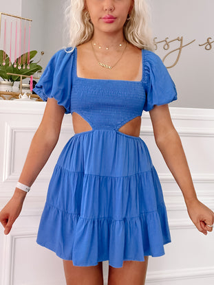 Cobalt blue mini dress with puff sleeves and cut-out detail.
