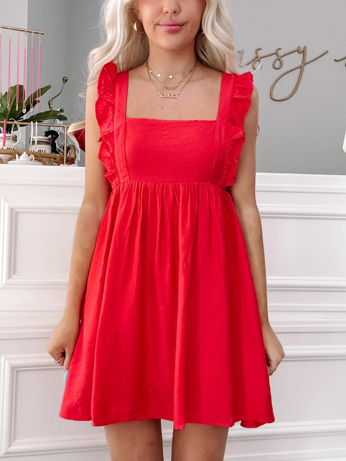 Red Ruby Ruffles mini dress with square neck and ruffle detailing.