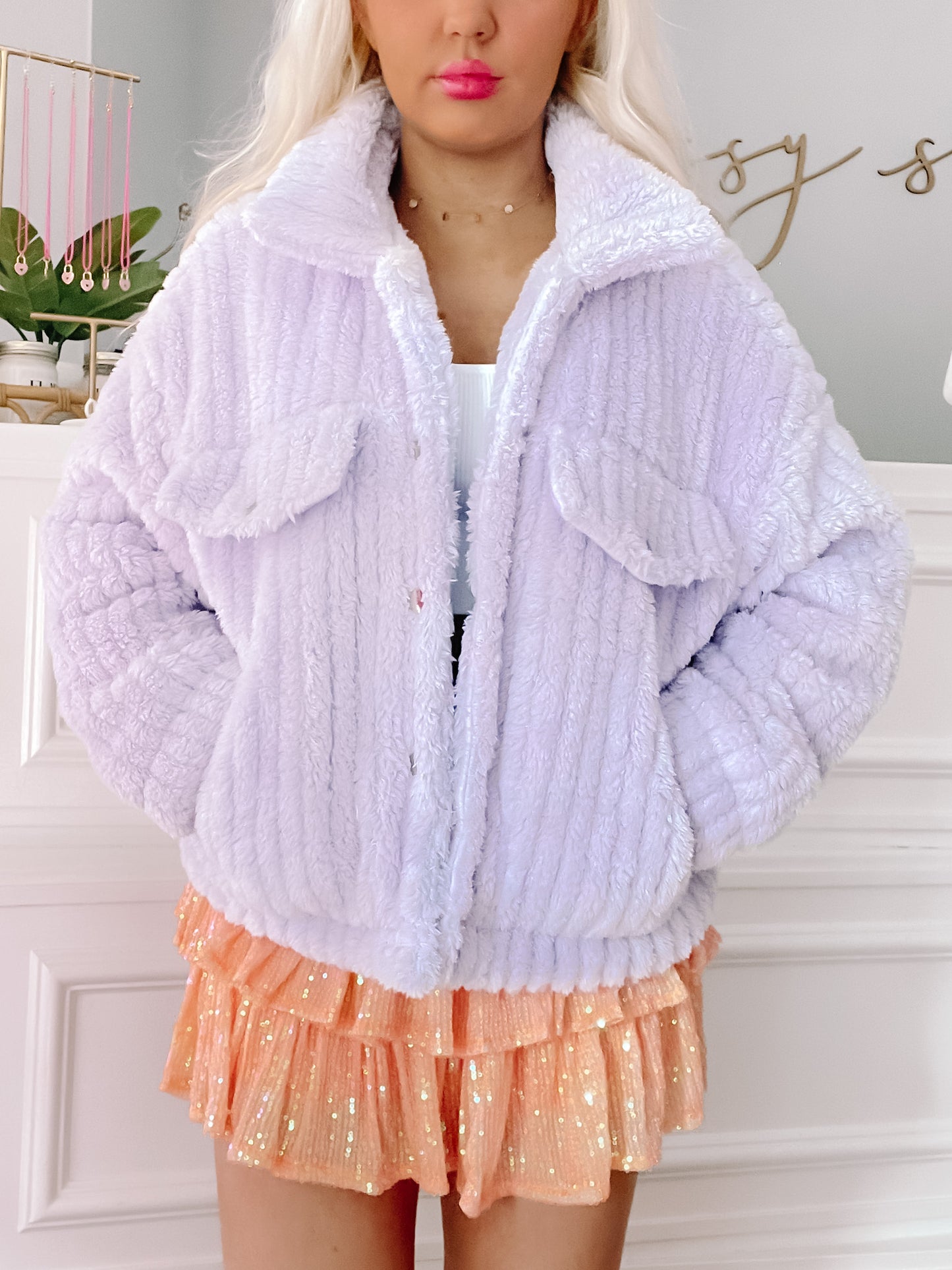 Lavender plush teddy jacket, button closure, shown on model.