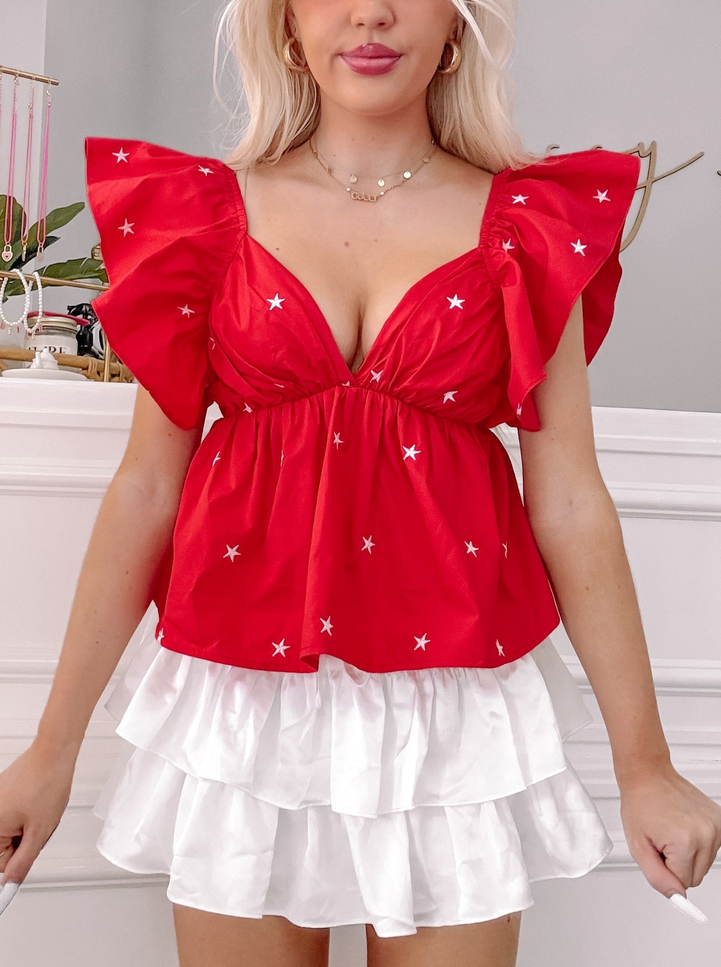 Red Party in the USA star print top with ruffle sleeves and white tiered skirt.
