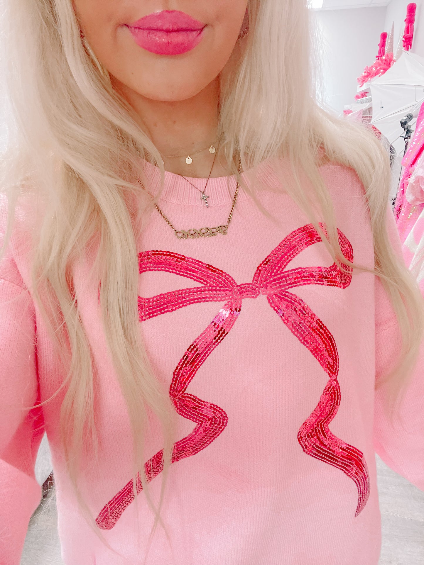 Pink sweater with sequined bow detail