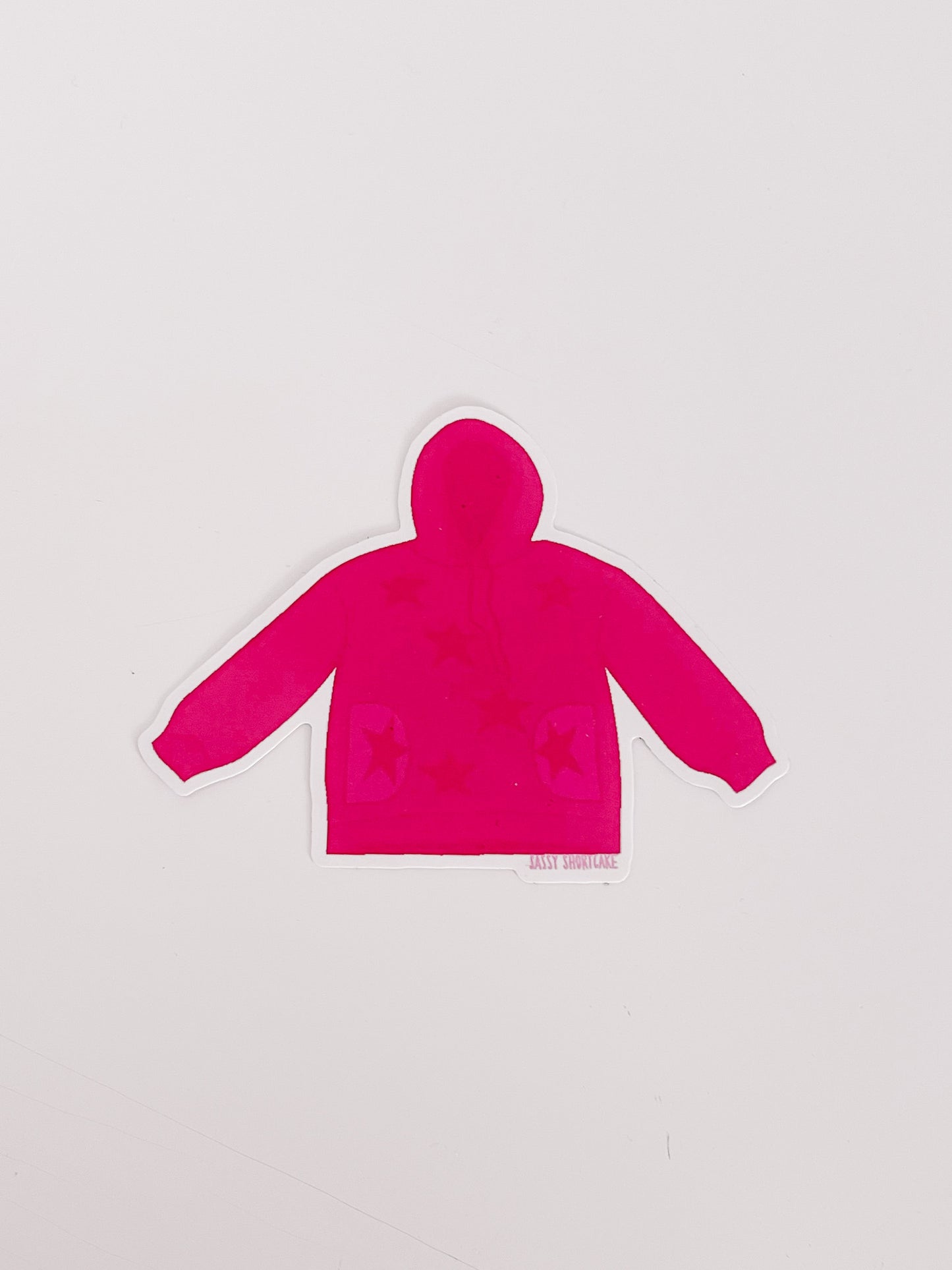 Pink hoodie sticker with stars, on a white background.