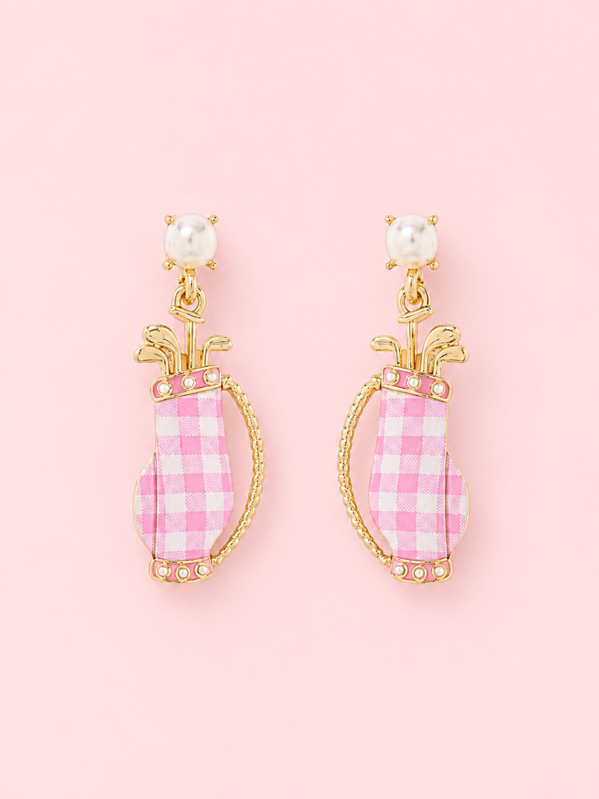 Par-Tee in Pink Earrings from Sassy Shortcake: Pink color coated golf bag earrings with gold metal details, faux pearl studs, and tiny golf club accents on a light pink background.