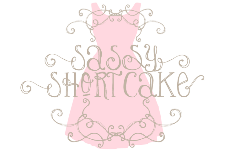 Handwritten gift certificate design featuring "Sassy Shortcake" text and a pink dress illustration.