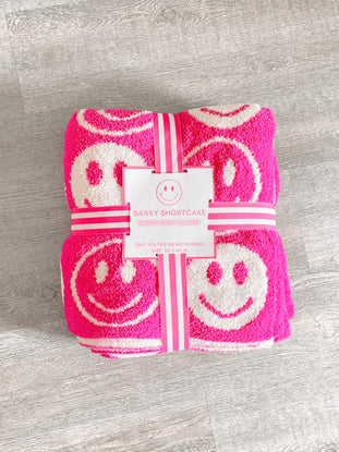 Pink smiley face blanket, 50x60 inches, soft microfiber.