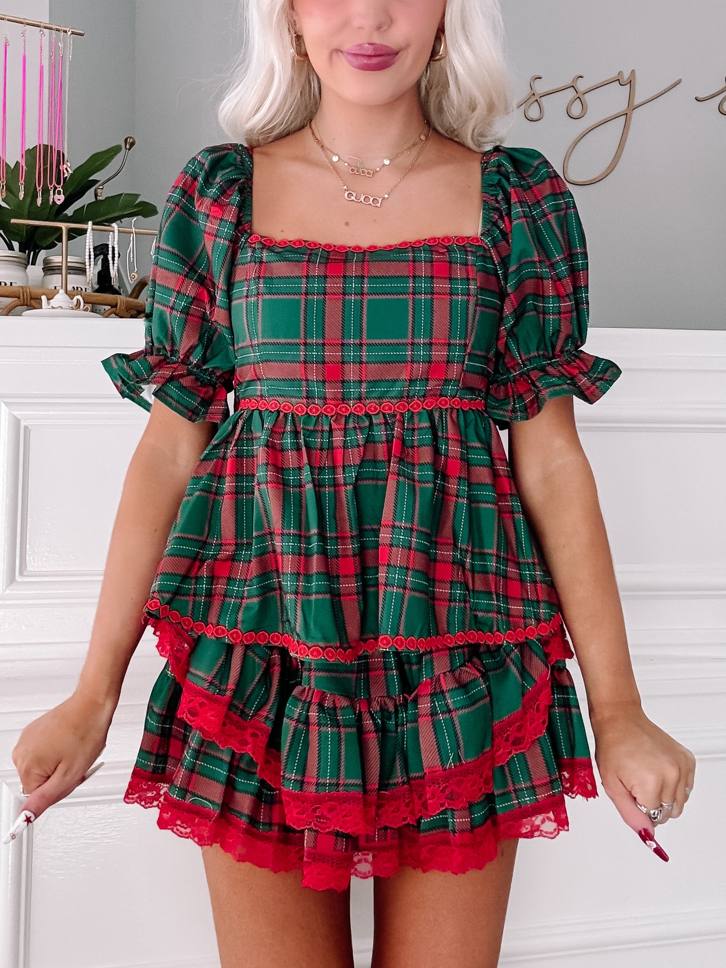 Tinsel Tartan Top: Festive green & red plaid top with ruffled hem & lace trim.