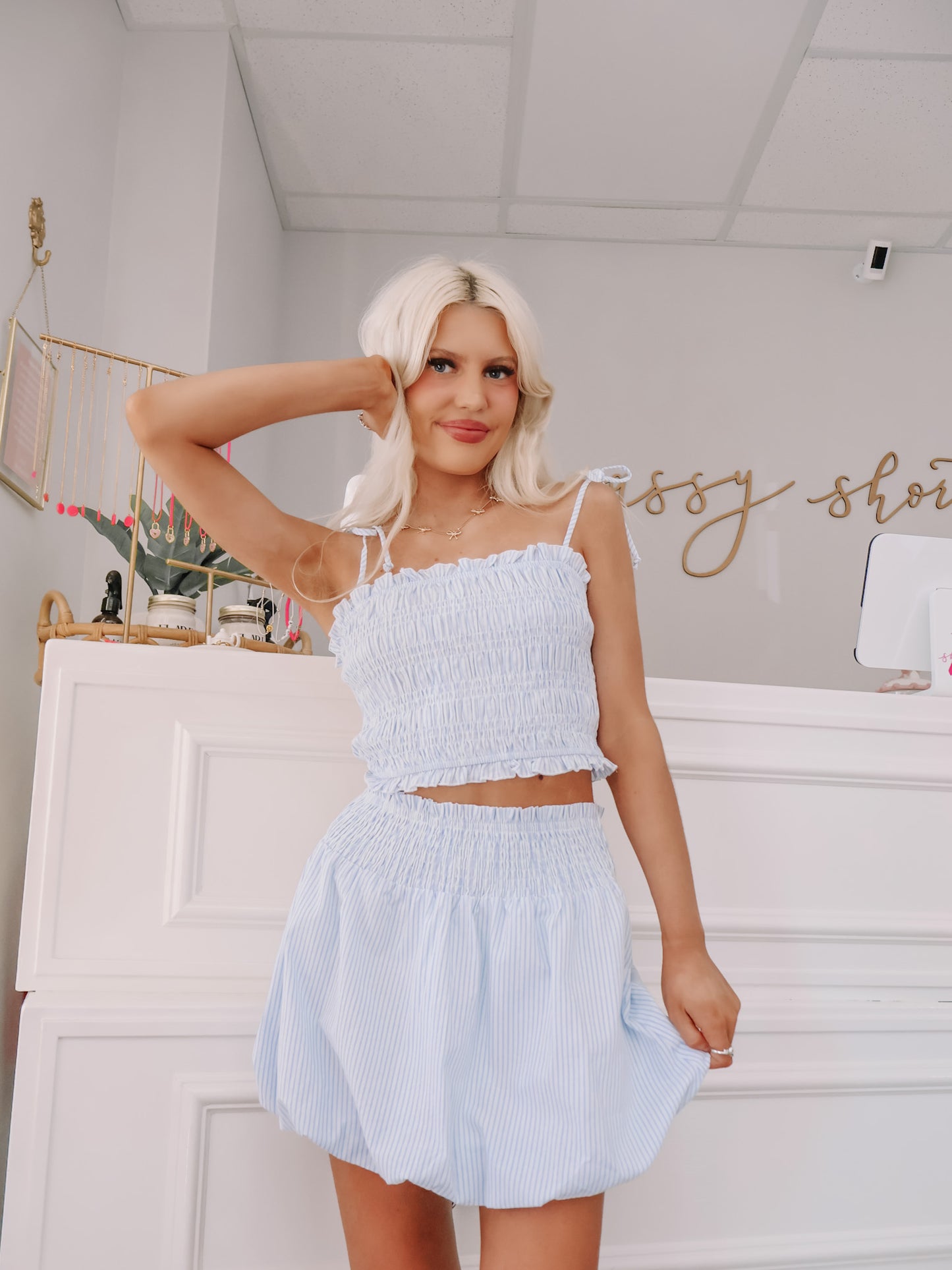 model wearing blue and white seersucker outfit set styled for summer