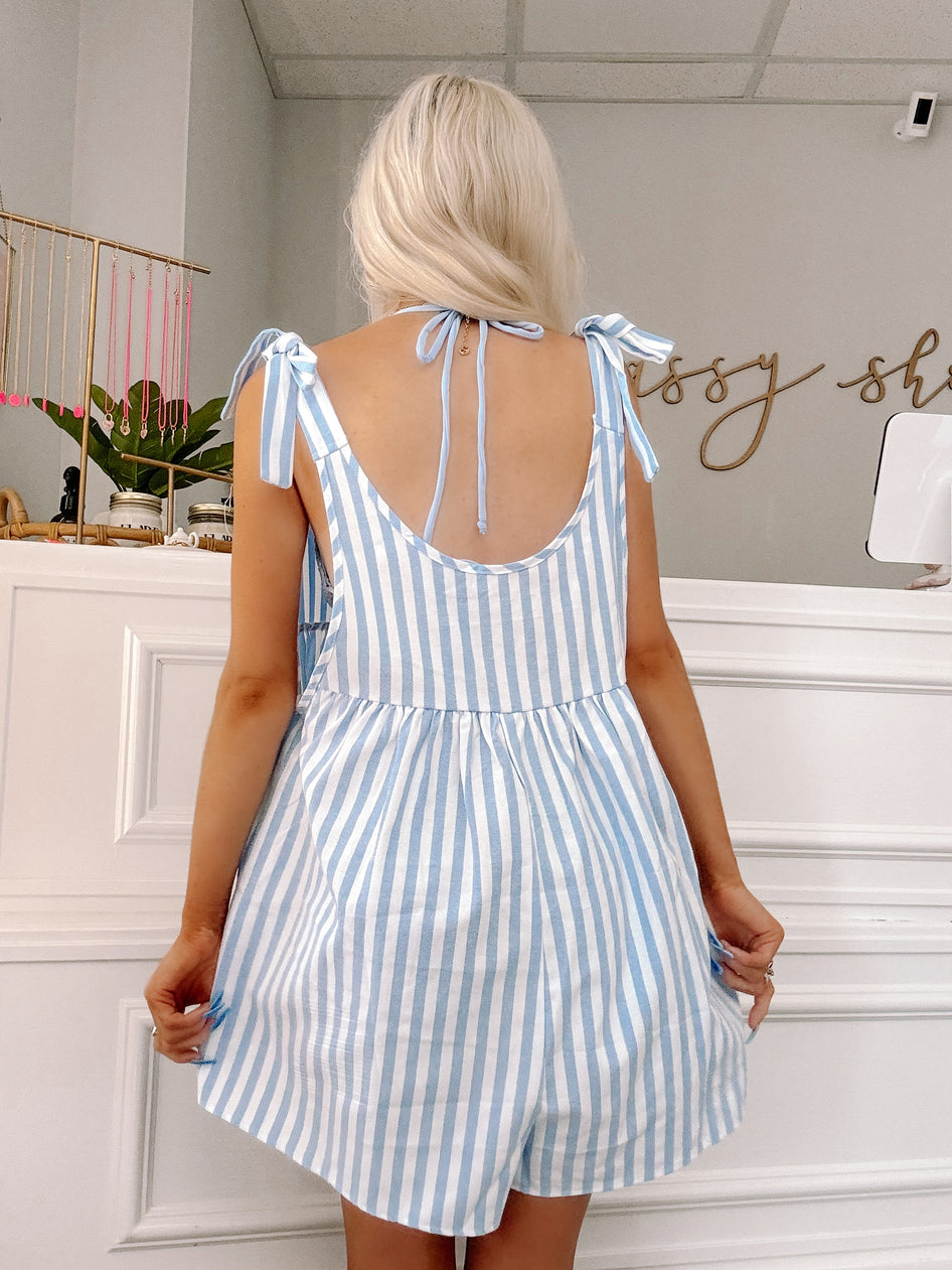 Back view of sleeveless blue striped romper