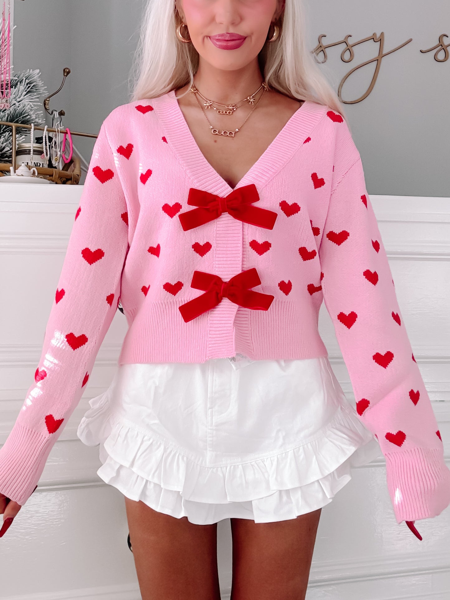 Pink Cupid's Bow cardigan with red hearts & velvet bows.