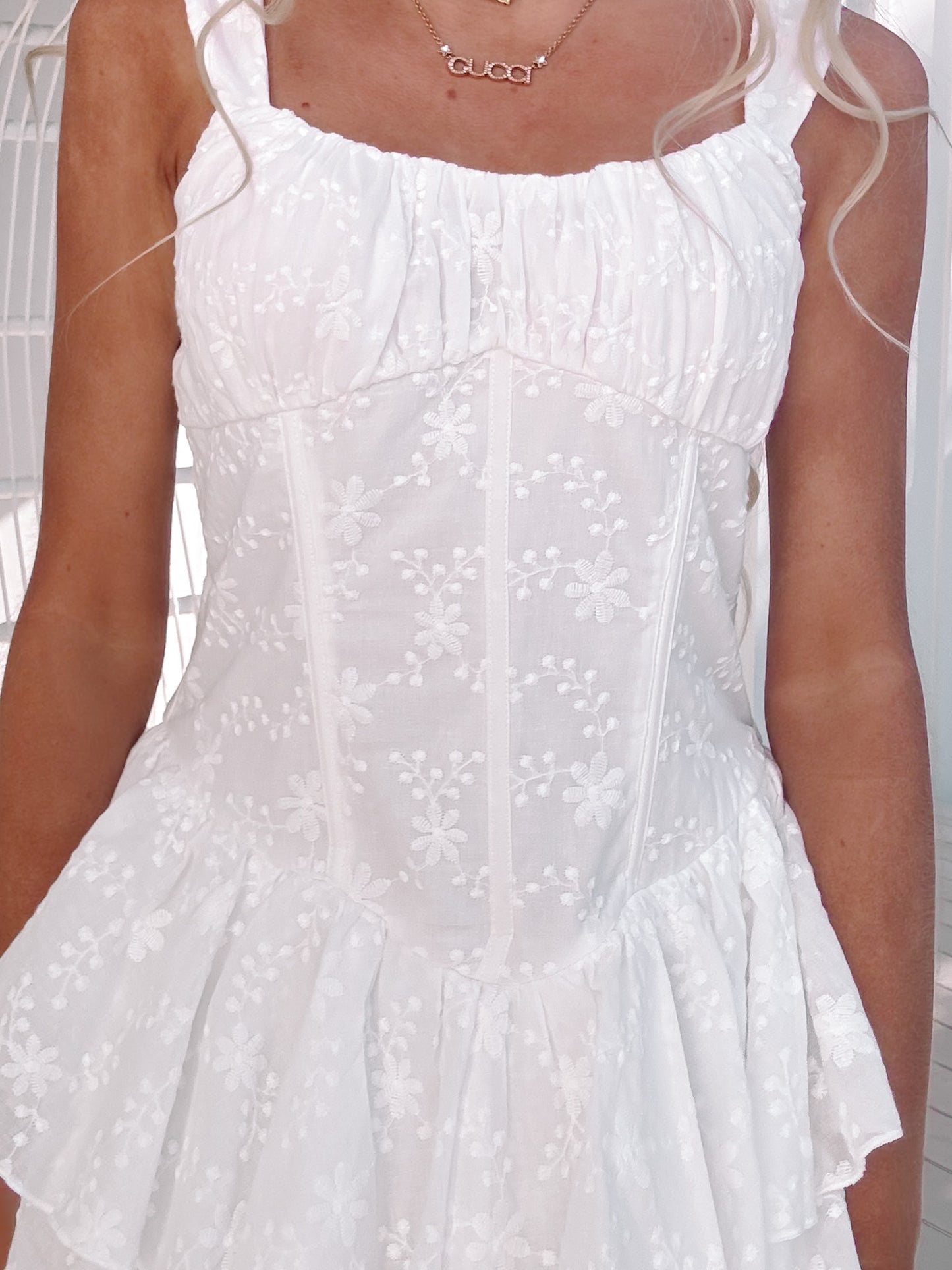 Close-up of ruched bust and delicate eyelet lace on Ever After Dress