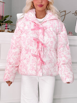 Fairytale Bow Jacket by Sassy Shortcake in ivory quilted floral with pink bow-tie zipper detail