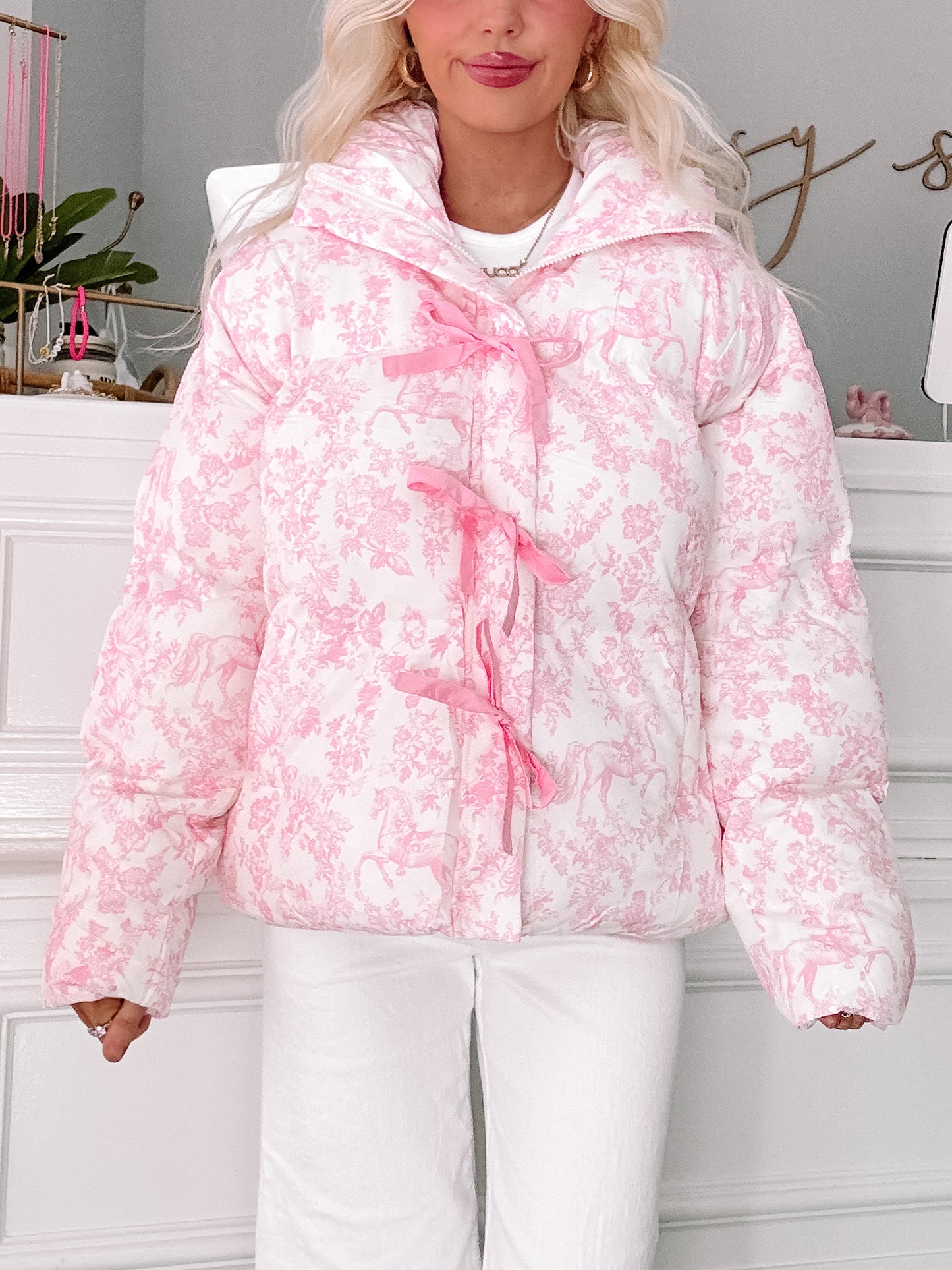 Fairytale Bow Jacket by Sassy Shortcake in ivory quilted floral with pink bow-tie zipper detail