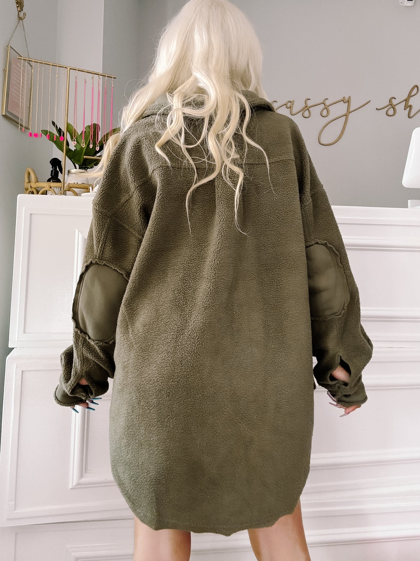 Olive green fleece shacket with elbow patches, shown from the back.