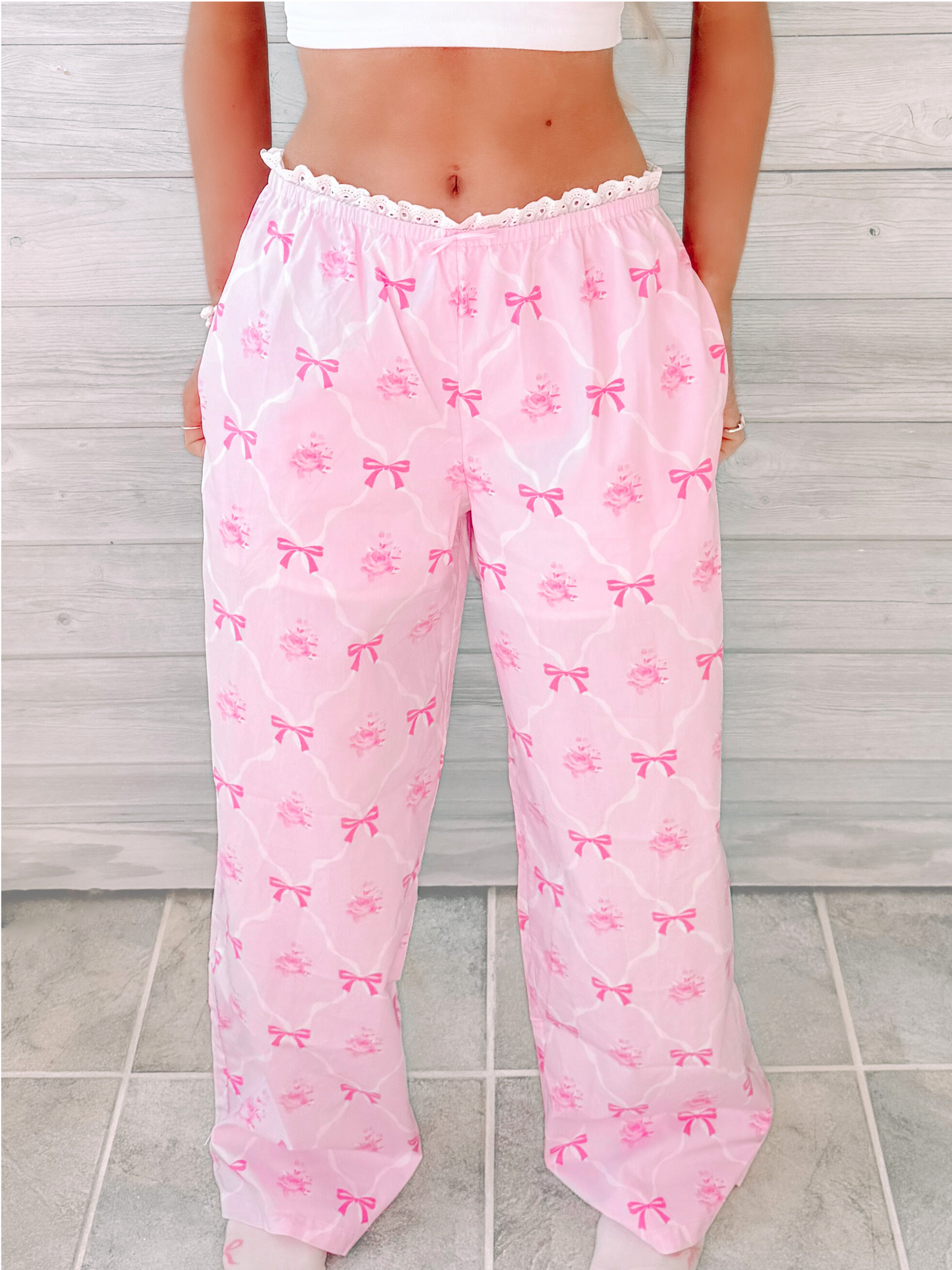 Pink Bow to Bed pajama pants with rose and bow print.