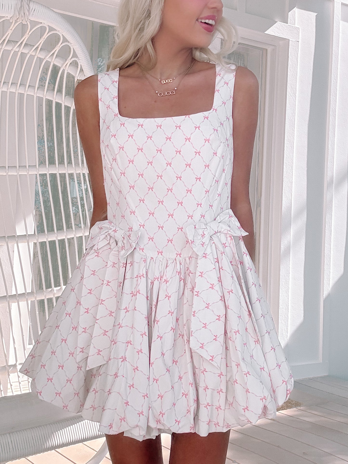 model wearing hot to bow dress