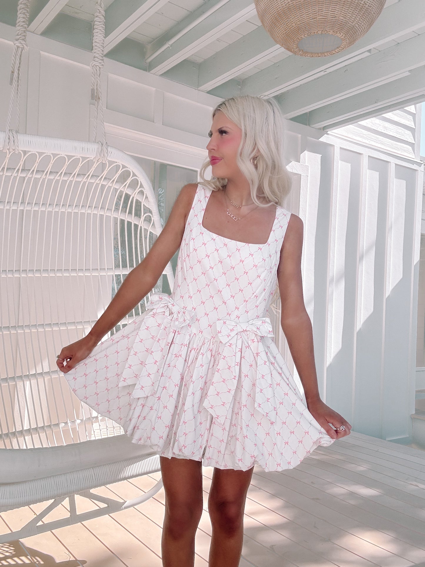 white dress with pink bow print