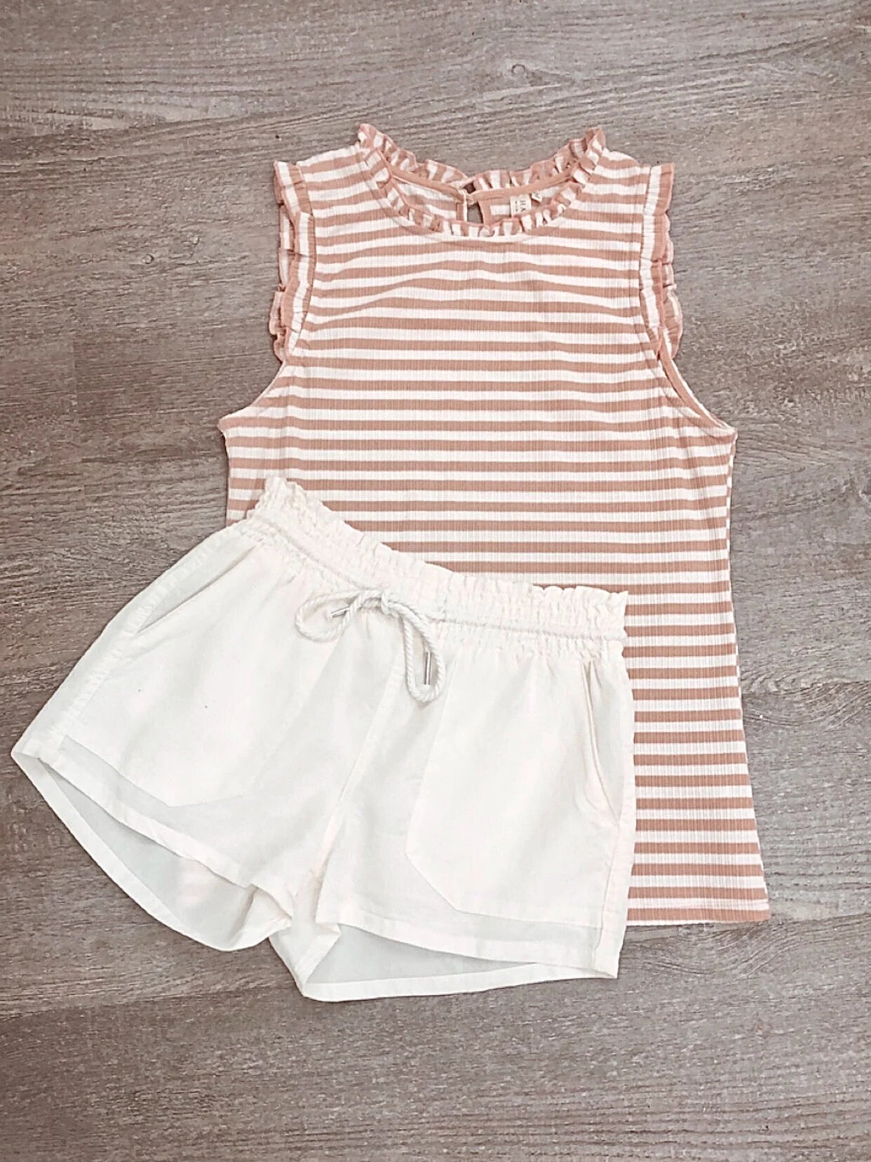 White In Plain View shorts with drawstring waist, perfect for summer.