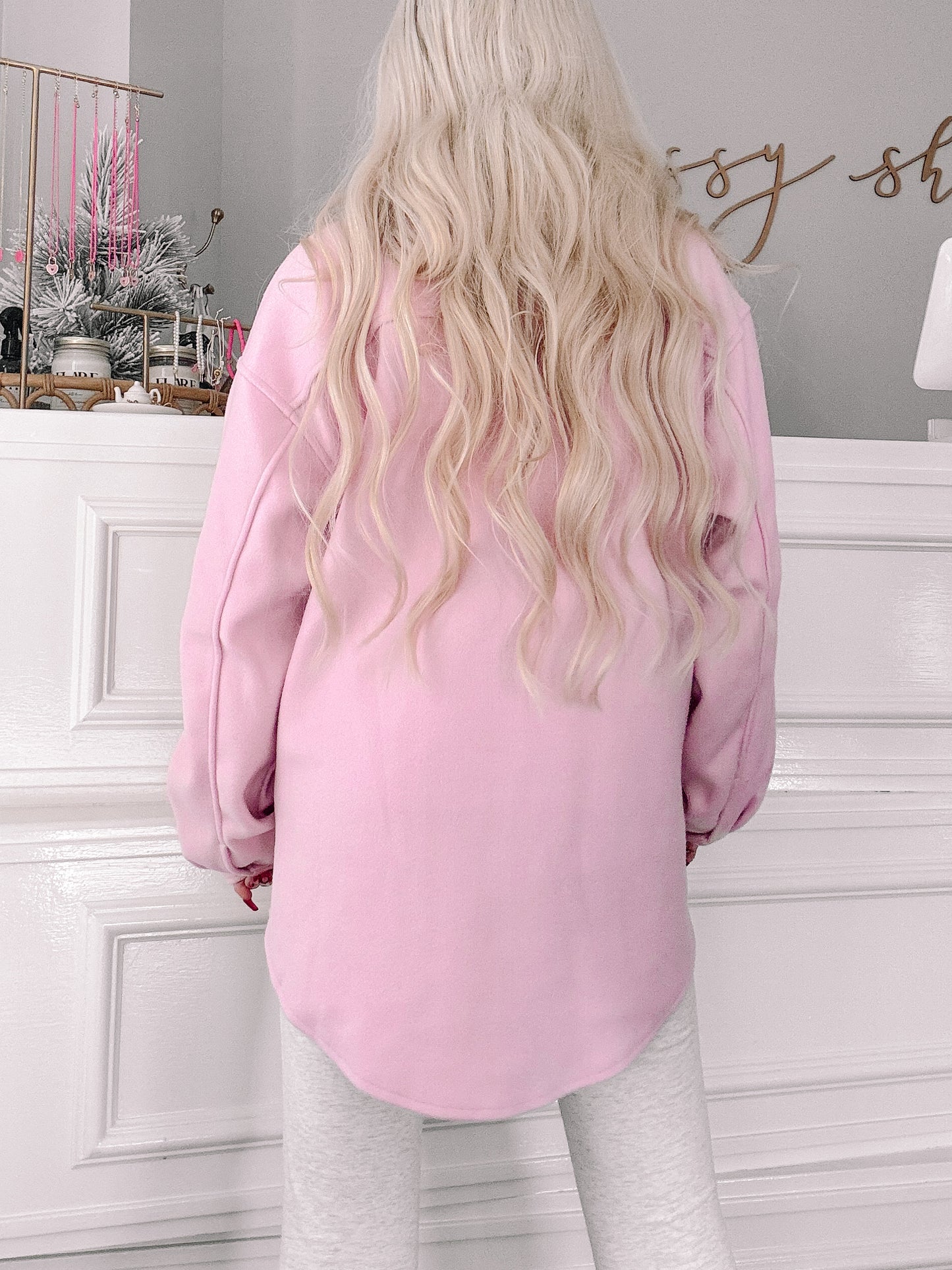 Back view of a pale pink oversized shacket.