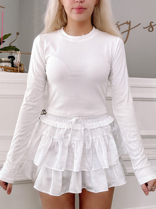 White ribbed long-sleeve Kendall top and ruffled mini skirt set