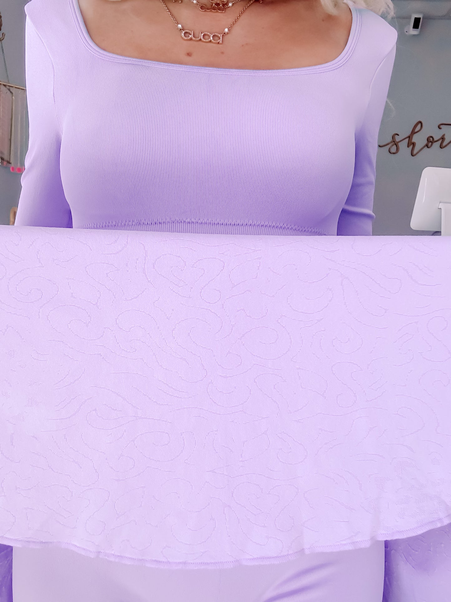 Lilac tennis dress with textured overlay, close-up detail from Sassy Shortcake