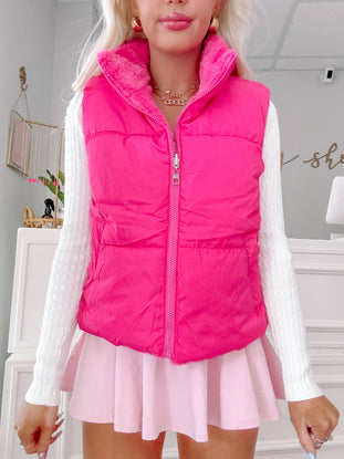 Hot pink Puff and Plush vest with faux fur collar.