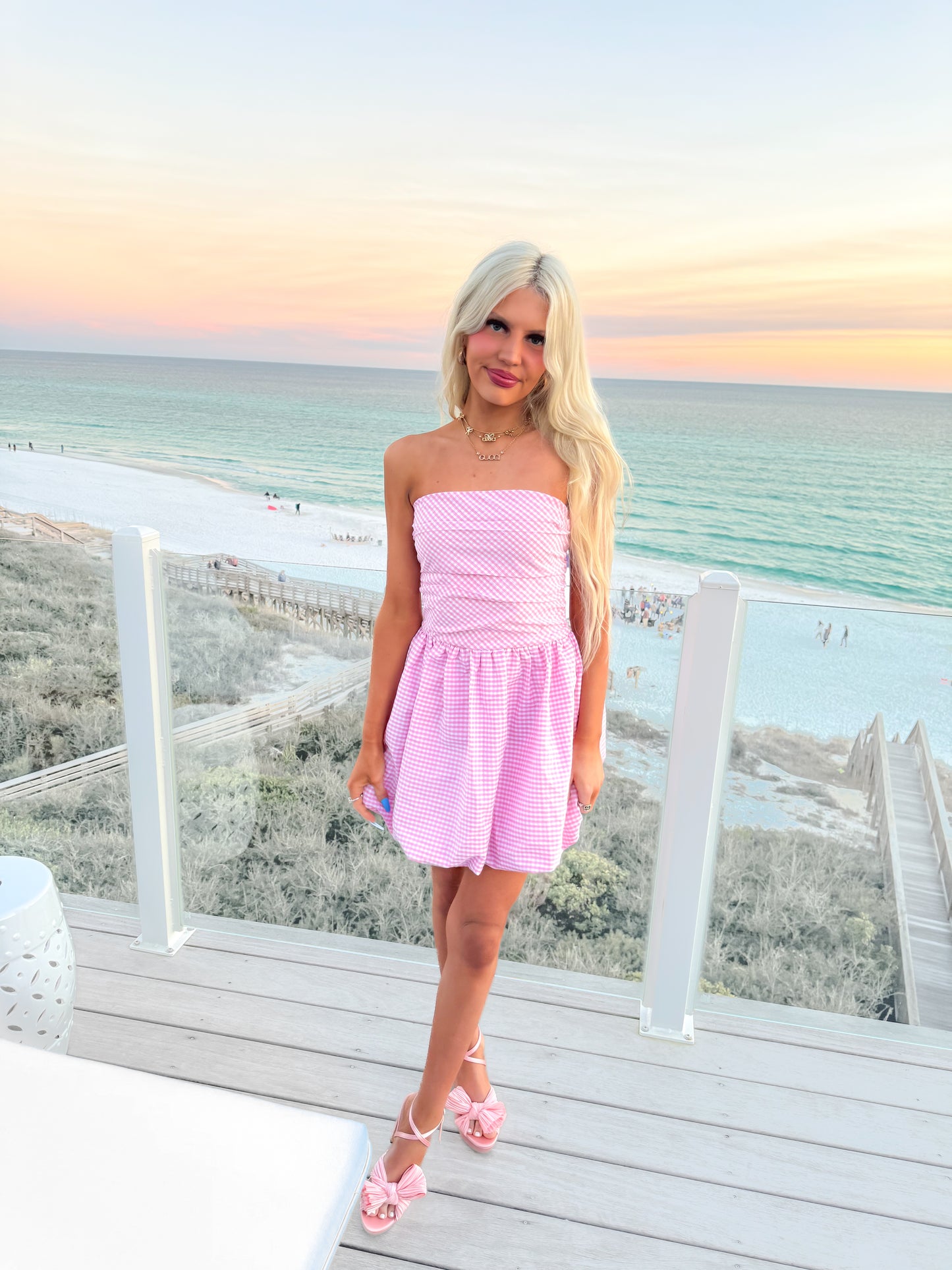 model wearing sassy shortcake pink gingham dress