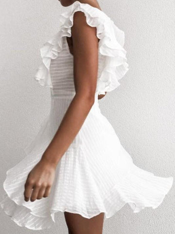 White eyelet mini dress with ruffled sleeves, shown on a model against a white background.