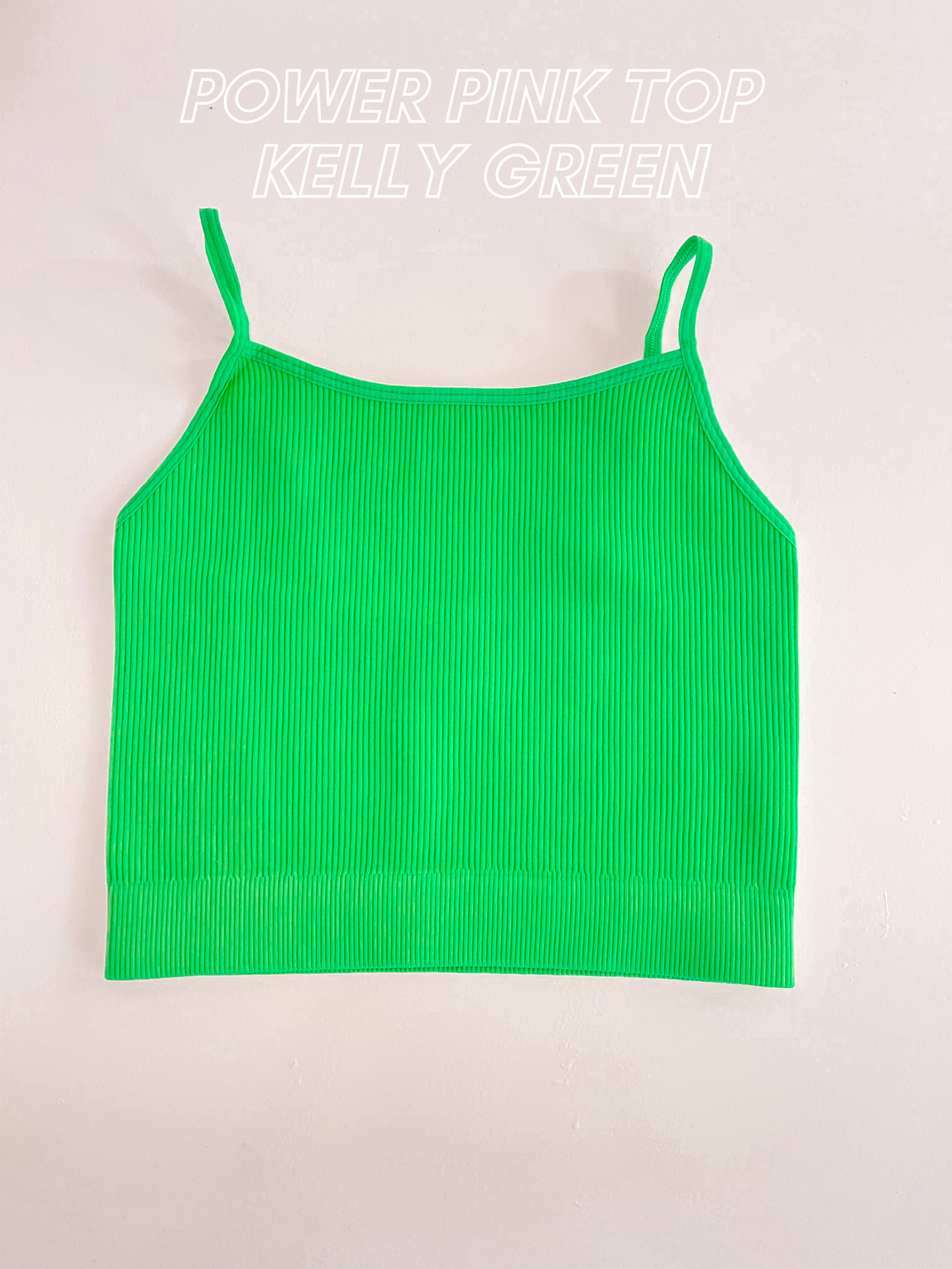 Bright green ribbed knit crop top, flat lay on white background.