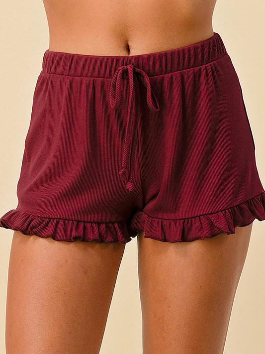 Garnet Sweet Sunday ribbed knit shorts with ruffle trim and drawstring waist.