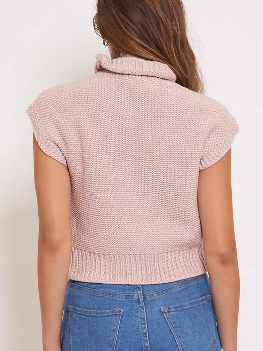Pink knit short-sleeve cropped sweater, mock turtleneck.