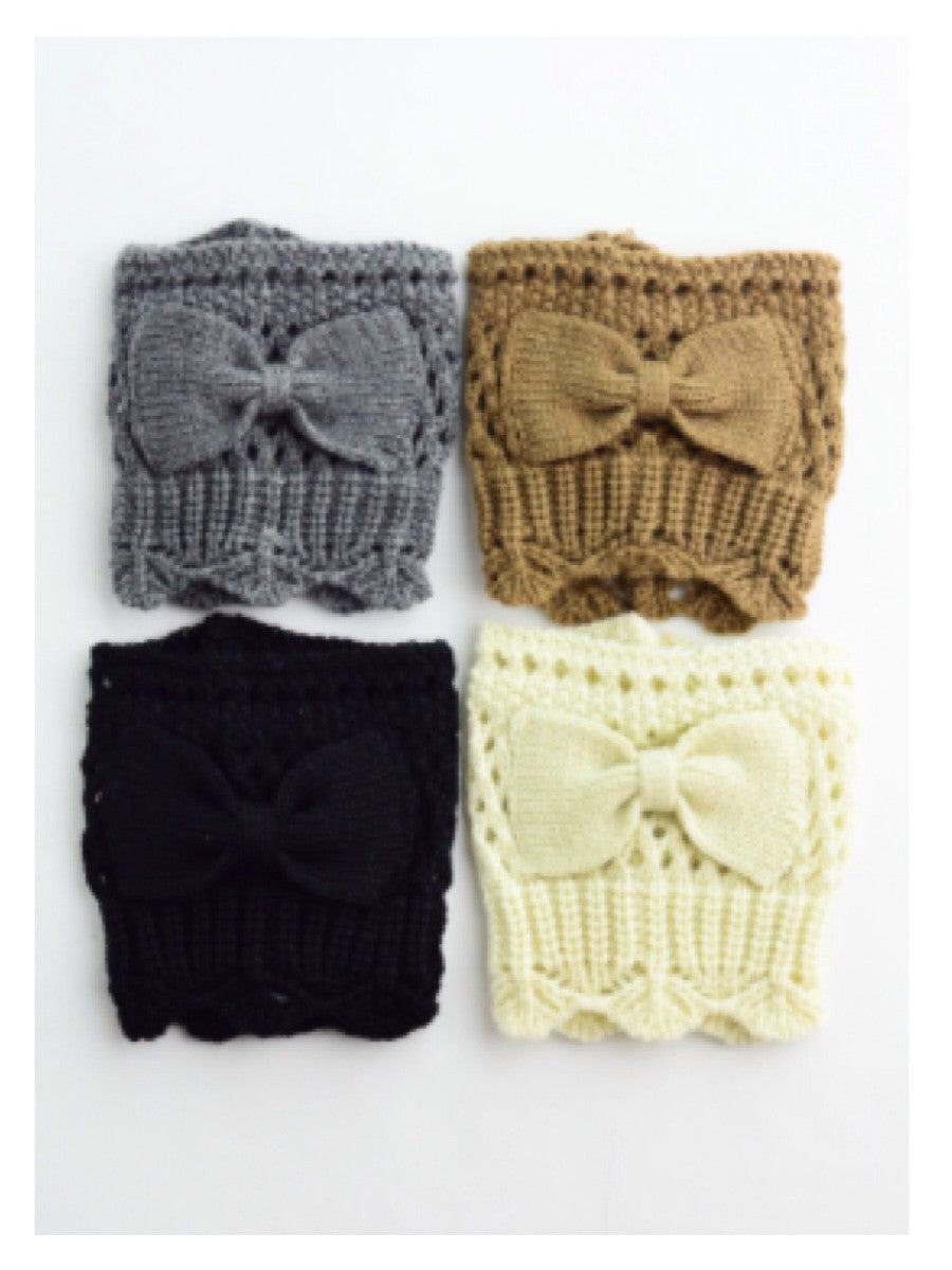 Knit boot cuffs with bows; gray, brown, black, and cream colors.