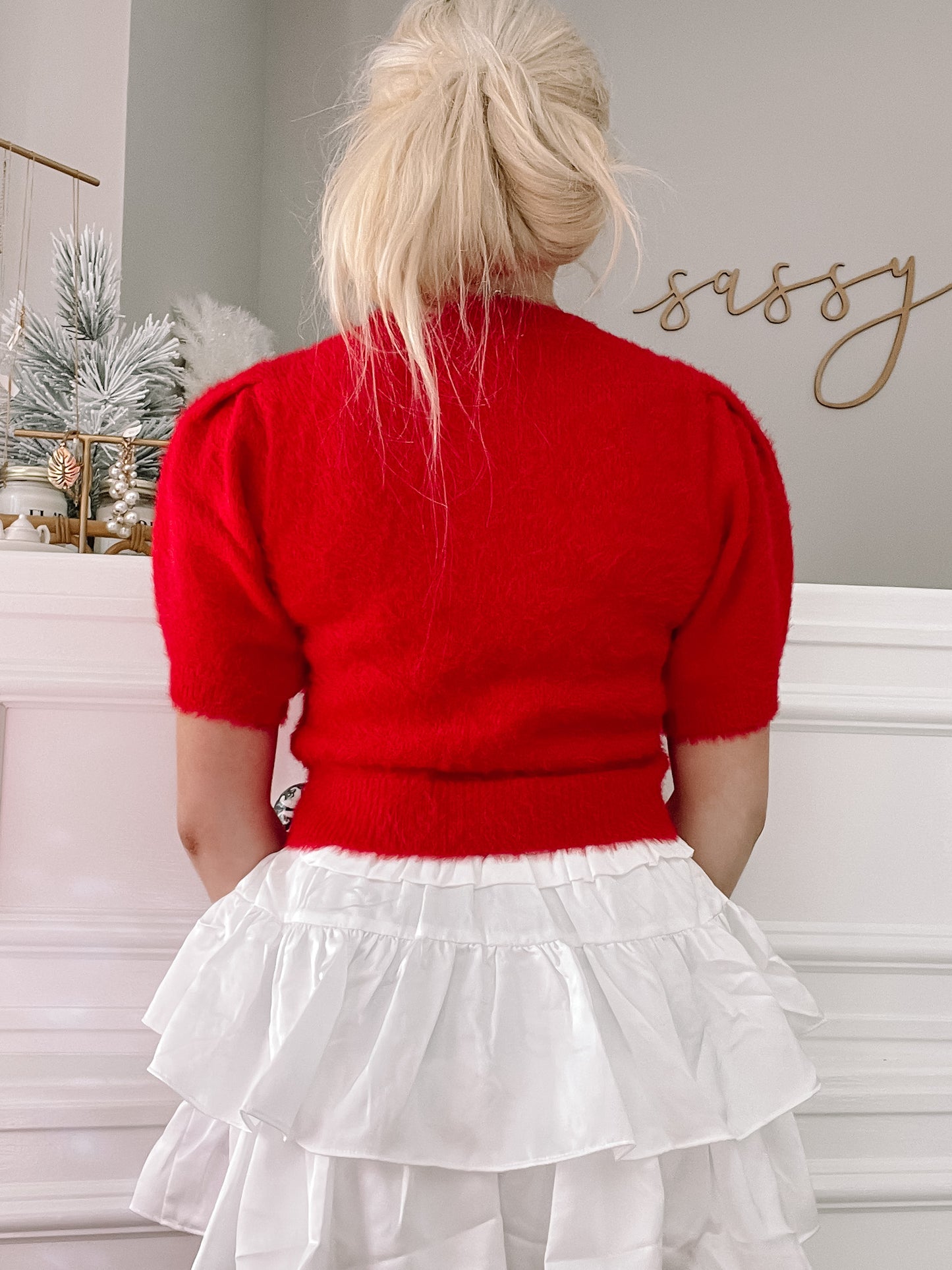 Red fuzzy short-sleeve sweater with puff shoulders, shown from the back.