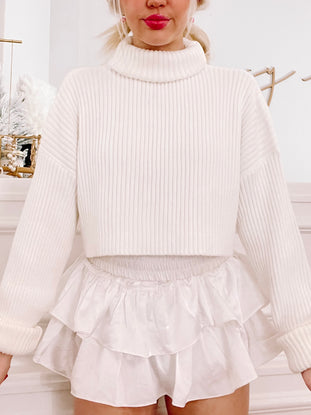 Cream Sydney Sweater: ribbed knit, turtleneck, cropped fit.