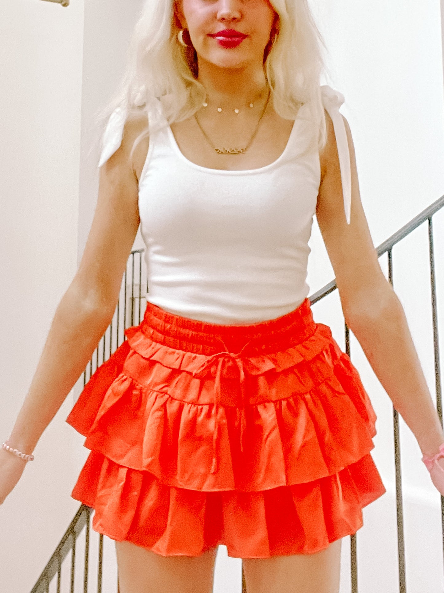 Flirtatious Ruffle Skirt in vibrant orange; tiered, drawstring waist.
