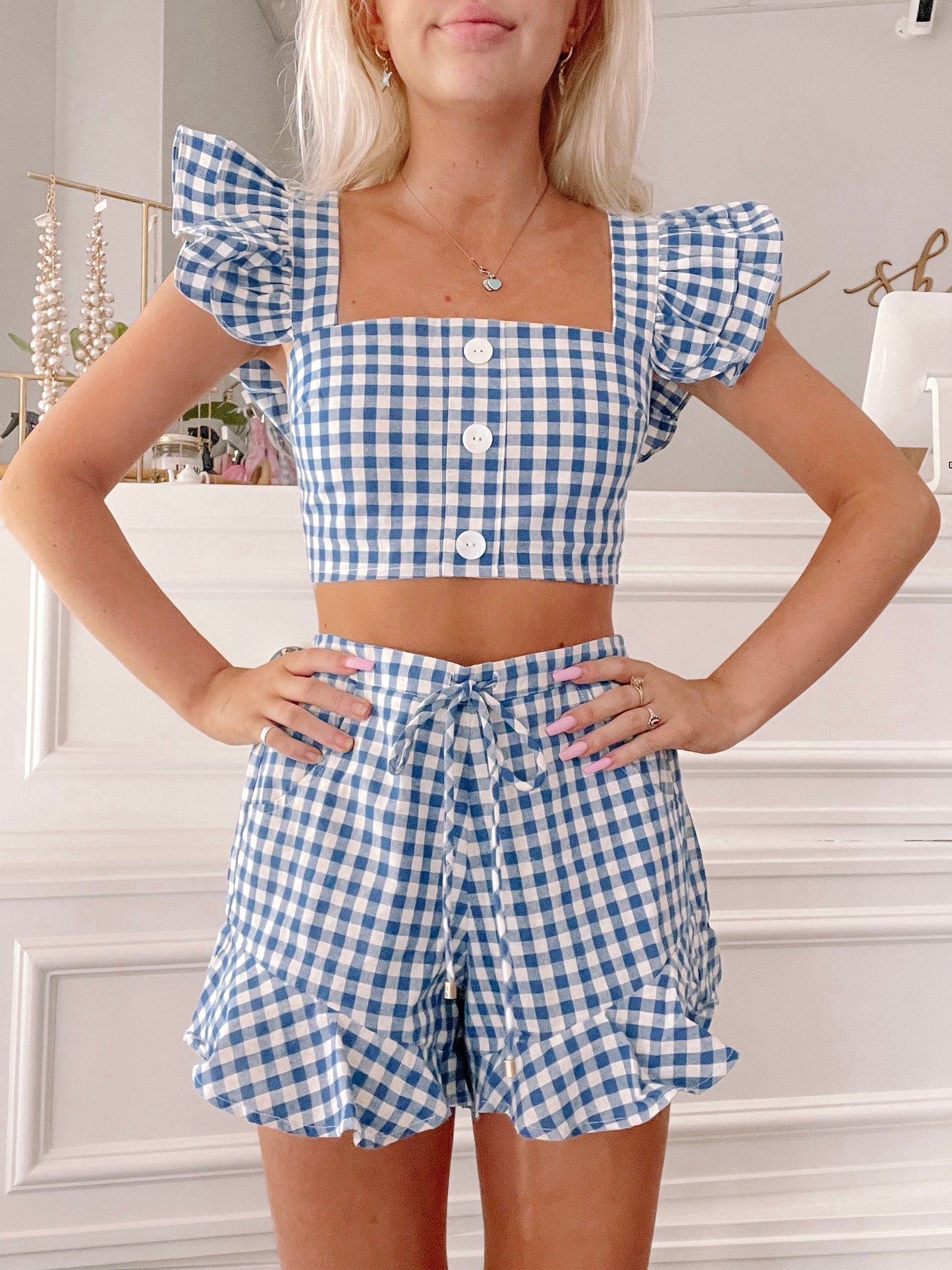 Blue gingham crop top and shorts set, ruffled trim detail.