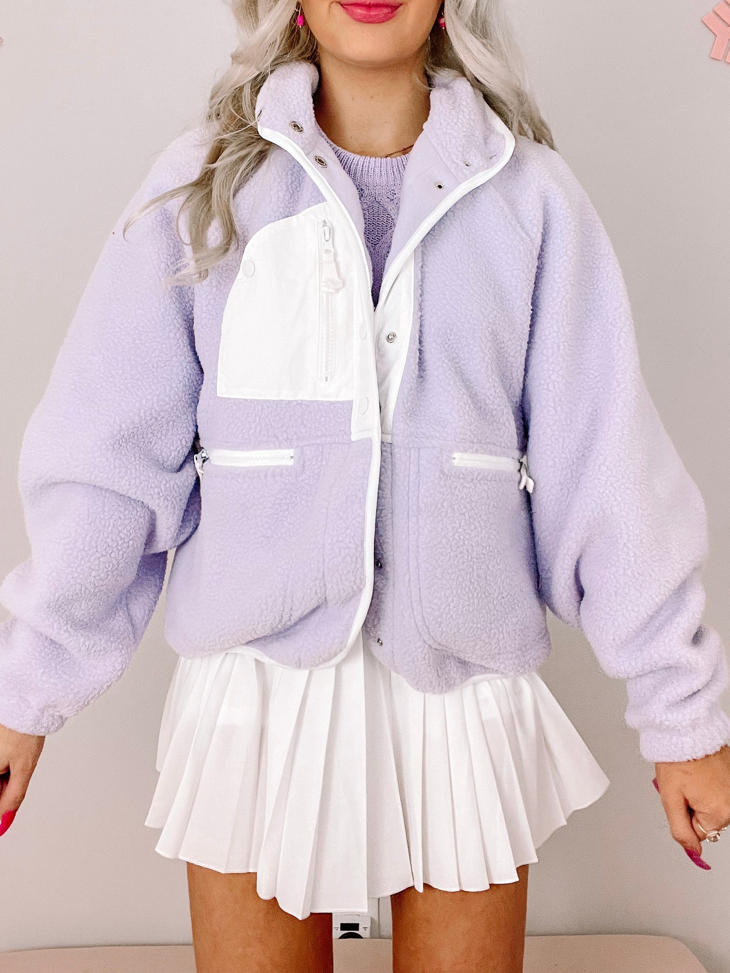 Lilac Heartbreaker sherpa jacket with white contrast panels and zip front.