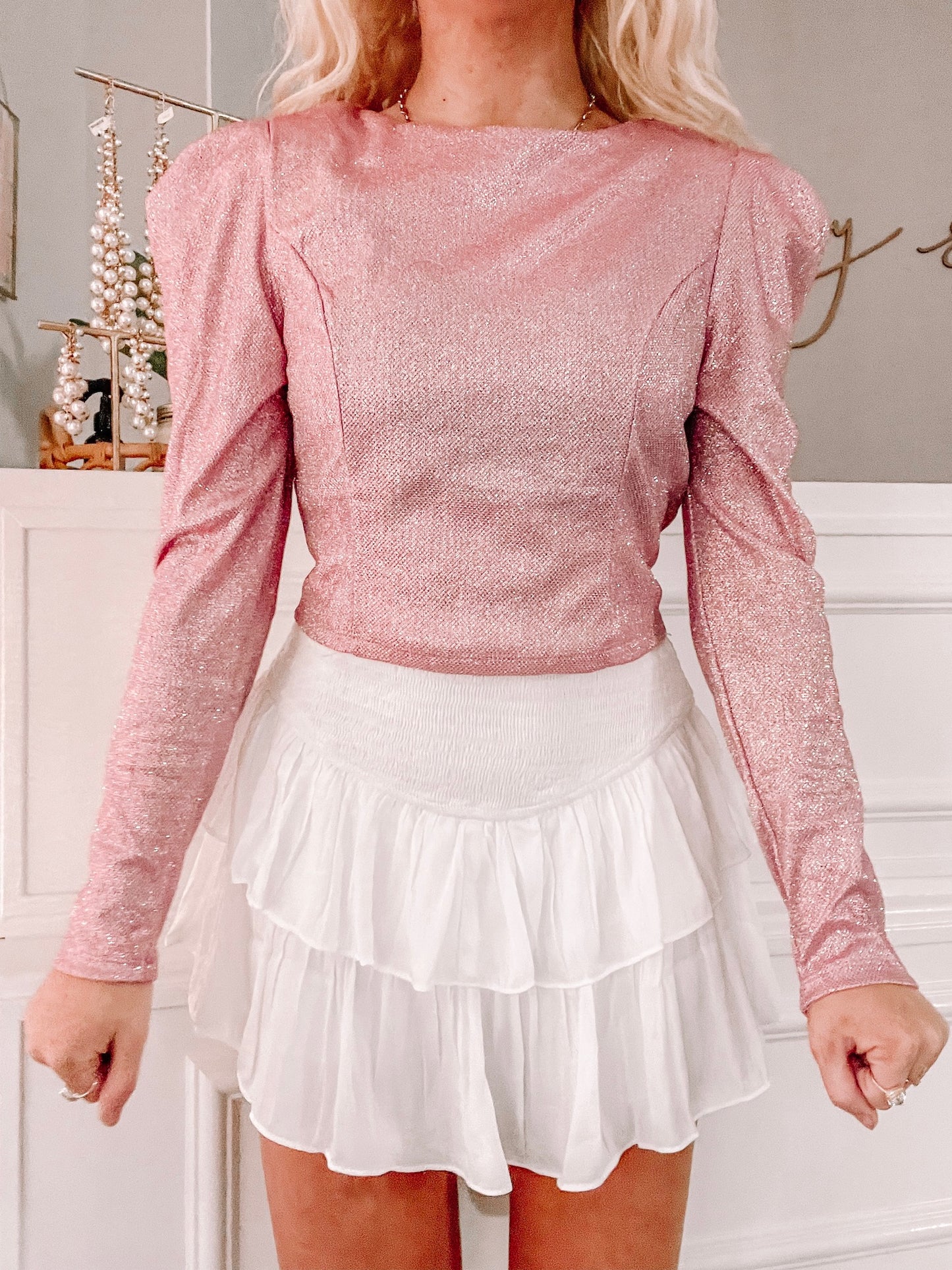 Pink Prosecco long-sleeve glitter top with puff shoulders; perfect for parties.